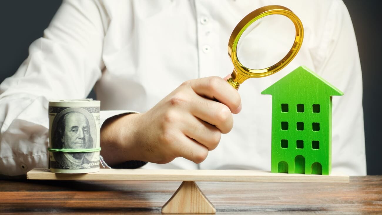 Appraiser determining the cost of damage to a house
