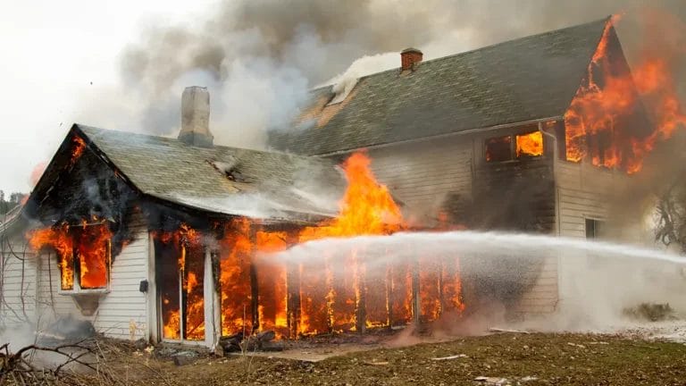 house engulfed in flames destroyed