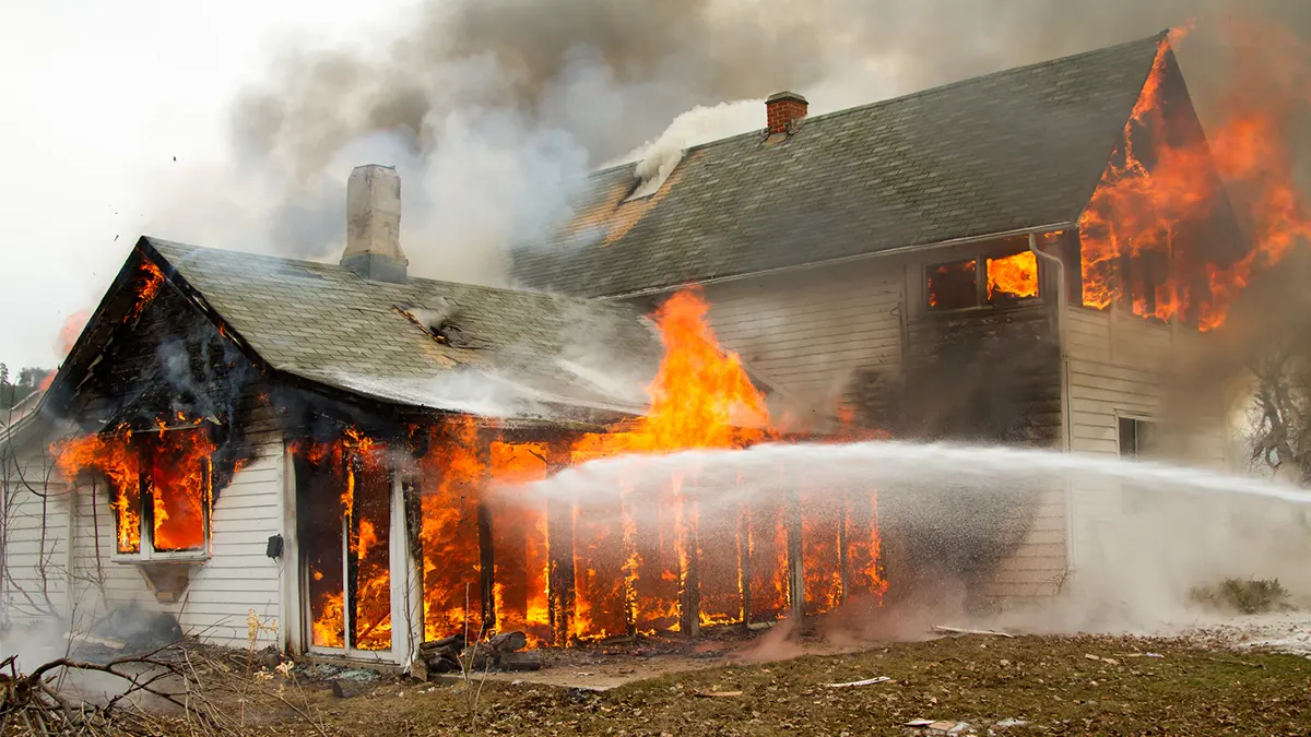 house engulfed in flames destroyed